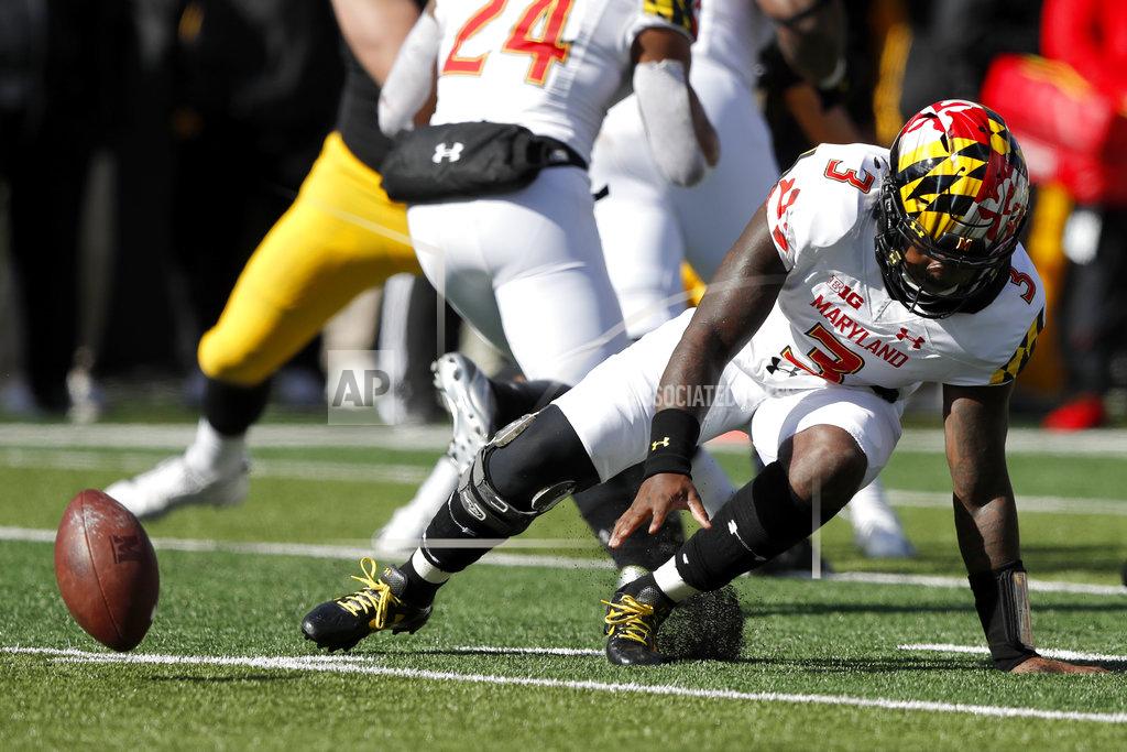 Charlie Neibergall Maryland quarterback Tyrrell Pigrome (3) fumbles the ball during the second half of an NCAA college football game against Iowa, Saturday, Oct. 20, 2018, in Iowa City, Iowa. Iowa defensive end Anthony Nelson recovered the ball in the end zone for a touchdown. Iowa won 23-0. (AP Photo/Charlie Neibergall)