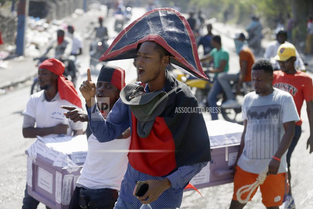 Dieu Nalio Chery A demonstrator dressed as an independence hero chants anti-government slogans during a protest to demand the resignation of Haiti's president Jovenel Moise in Port-au-Prince, Haiti, Wednesday, Jan. 20, 2021. Moise has one more year in power, but a growing groundswell of opposition is organizing protests and demanding he resign next month amid spiraling crime and a crumbling economy. ( AP Photo/ Dieu Nalio Chery)