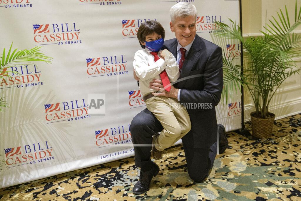 Matthew Hinton Sen. Bill Cassidy, R-La., takes a photo with his grandson Samuel Cassidy, 6, after he addressed supporters at his election watch party on Election Night in Baton Rouge, La., Tuesday, Nov. 3, 2020. (AP Photo/Matthew Hinton)