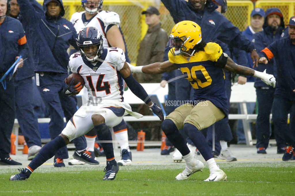 Mike Roemer Denver Broncos wide receiver Courtland Sutton (14) runs with the ball after catching a pass as Green Bay Packers cornerback Kevin King (20) defends during the second half of an NFL football game Sunday, Sept. 22, 2019, in Green Bay, Wis. (AP Photo/Mike Roemer)