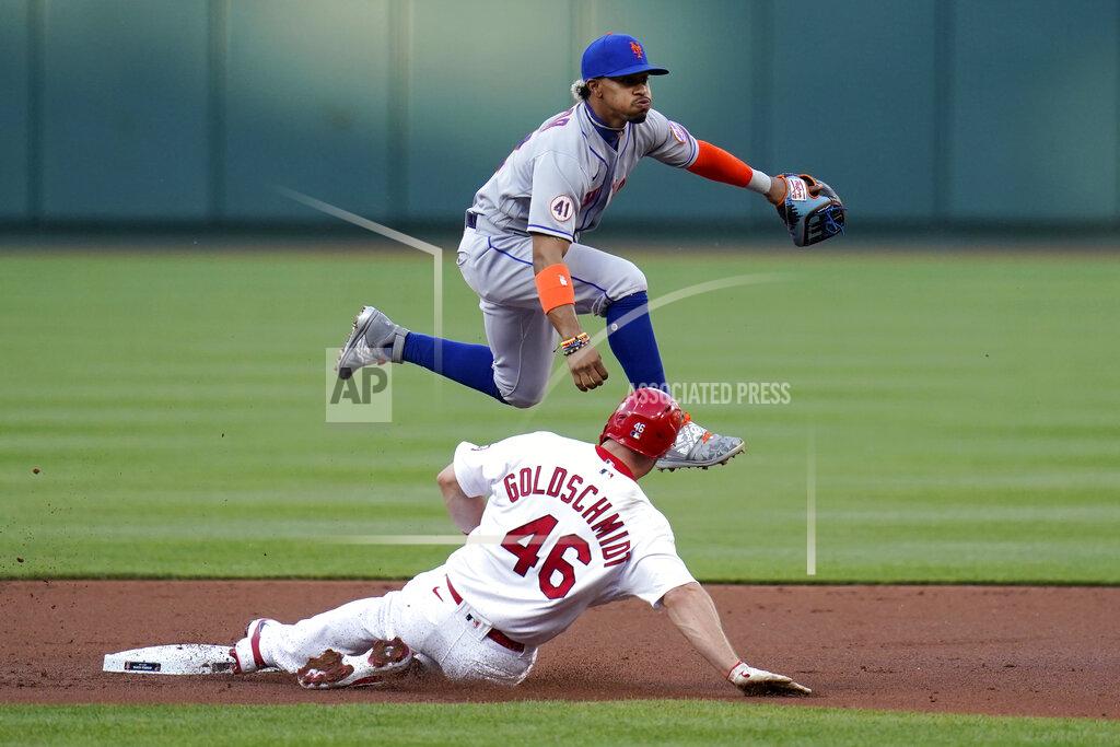 Jeff Roberson St. Louis Cardinals' Paul Goldschmidt (46) is out at second as New York Mets shortstop Francisco Lindor turns the double play during the first inning of a baseball game Monday, May 3, 2021, in St. Louis. The Cardinals' Nolan Arenado was out at first. (AP Photo/Jeff Roberson)