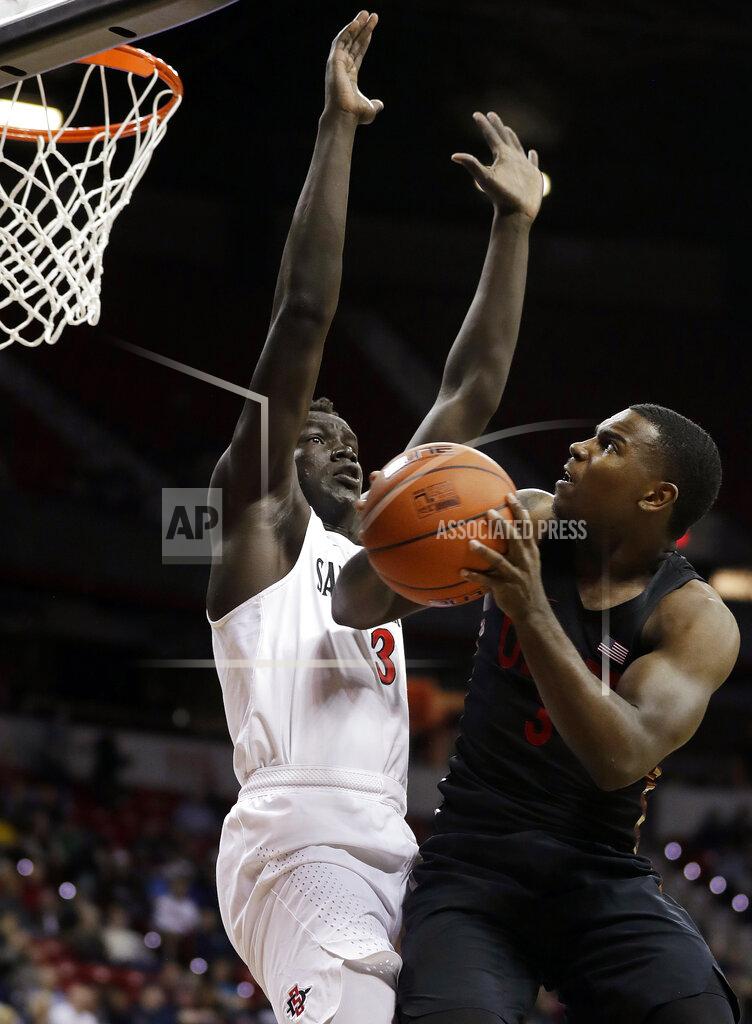 Isaac Brekken San Diego State's Aguek Arop (3) defends as UNLV's Amauri Hardy shoots during the second half of an NCAA college basketball game in the Mountain West Conference men's tournament Thursday, March 14, 2019, in Las Vegas. (AP Photo/Isaac Brekken)