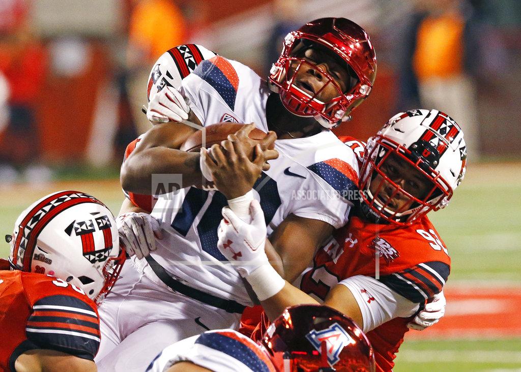 Rick Bowmer Utah defensive end Maxs Tupai, right, tackles Arizona quarterback Jamarye Joiner (10) during the first half of an NCAA college football game Friday, Oct. 12, 2018, in Salt Lake City. (AP Photo/Rick Bowmer)