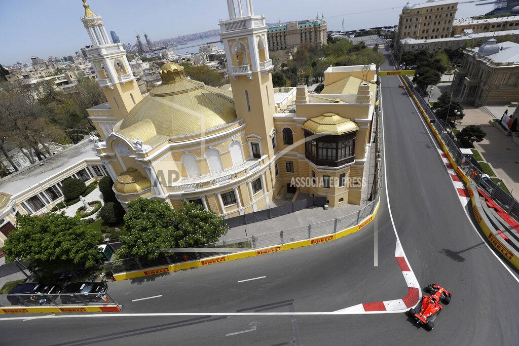 FILE - In this Friday, April 27, 2018 file photo, Germany driver Sebastian Vettel steers his Ferrari during the first free practice session at the Baku Formula One city circuit, in Baku, Azerbaijan. Baku renewed its contract on Tuesday Feb. 5, 2019, to host Formula One’s Azerbaijan Grand Prix through 2023, prolonging the stay of a circuit which initially struggled for acceptance but has since become a fan favorite. (AP Photo/Luca Bruno, File)