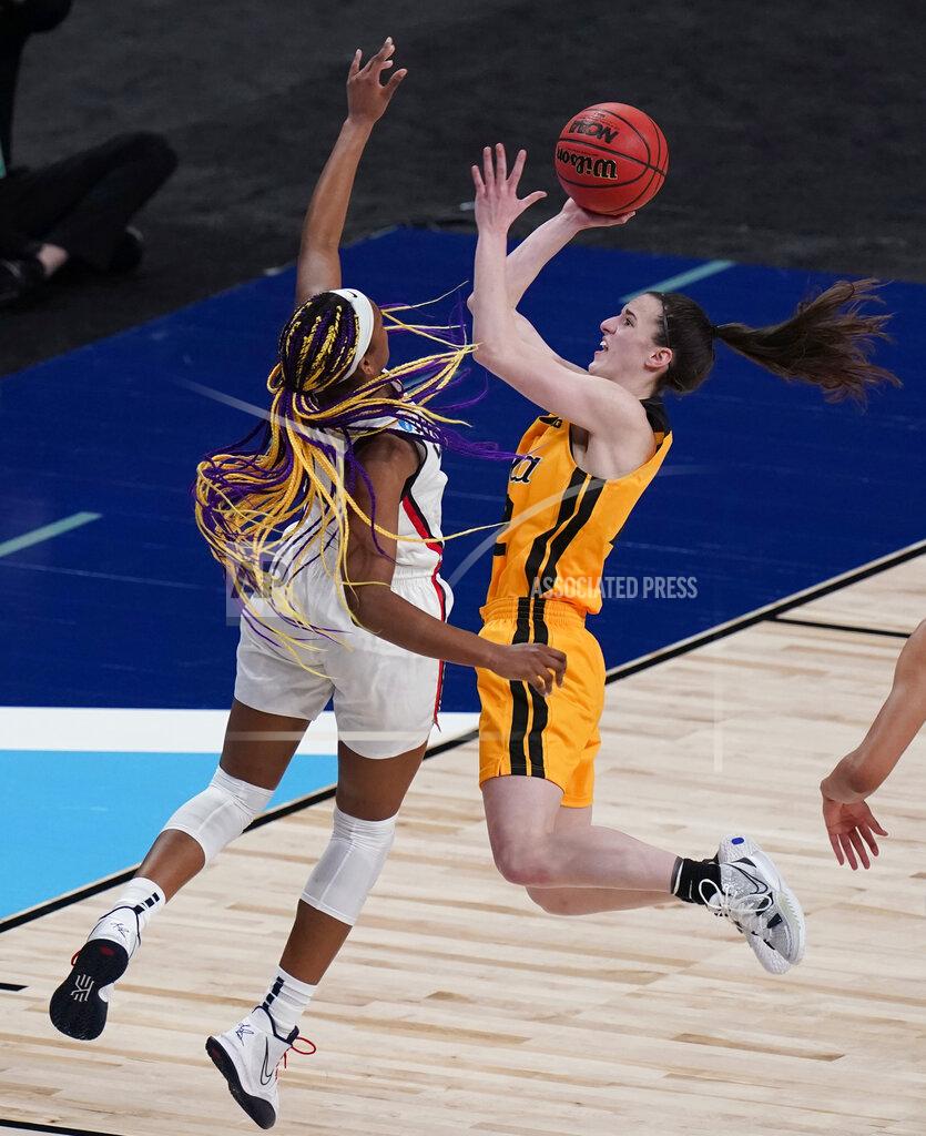 Eric Gay FILE - Iowa guard Caitlin Clark (22) drives to the basket against UConn forward Aaliyah Edwards (3) during the first half of a college basketball game in the Sweet Sixteen round of the women's NCAA tournament at the Alamodome in San Antonio, in this Saturday, March 27, 2021, file photo. Clark was named to the preseason Associated Press NCAA college basketball All-America team on Tuesday, Oct. 26, 2021. (AP Photo/Eric Gay, File)
