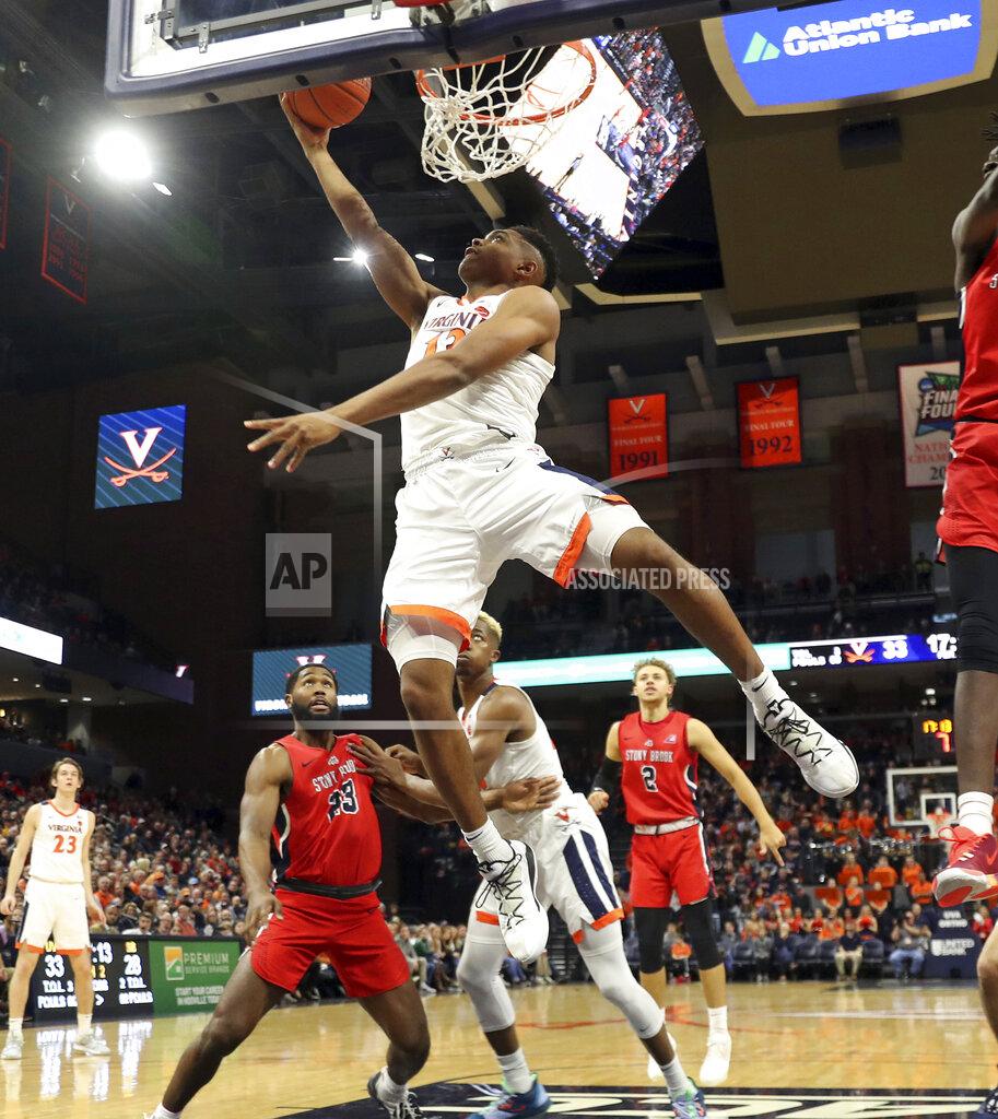 Andrew Shurtleff Virginia guard Casey Morsell (13) shoots over Stony Brook defenders during an NCAA college basketball game in Charlottesville, Va., Wednesday, Dec. 18, 2019. Virginia won 56-44. (AP Photo/Andrew Shurtleff)