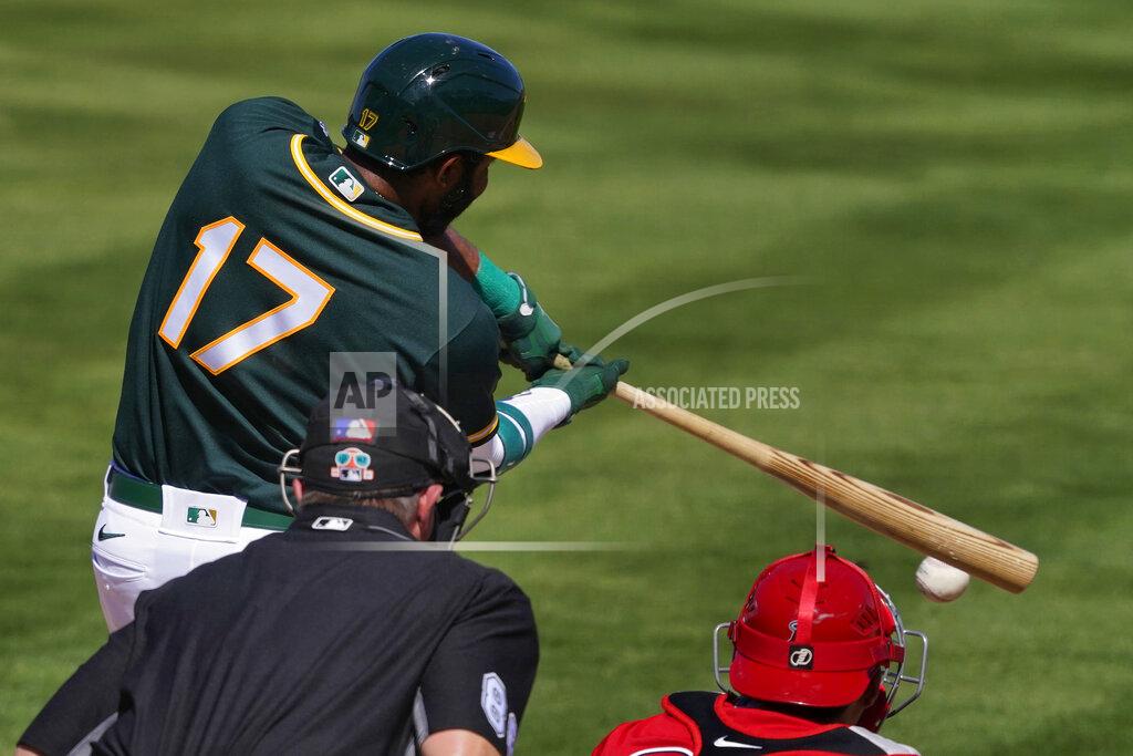 Matt York Oakland Athletics' Elvis Andrus (17) connects for a double during the first inning of a spring training baseball game against the Los Angeles Angels, Friday, March 5, 2021, in Mesa, Ariz. (AP Photo/Matt York)