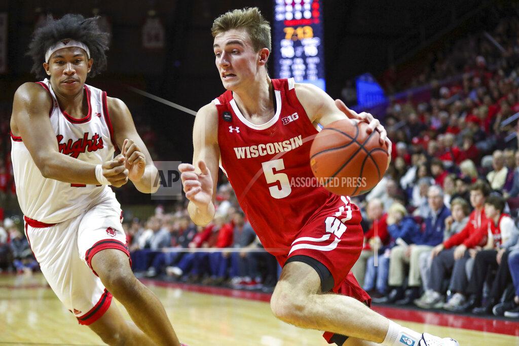 Andrew Mills Rutgers guard Ron Harper Jr., left, defends as Wisconsin forward Tyler Wahl (5) drives during the first half of an NCAA college basketball game in Piscataway, N.J., Wednesday, Dec. 11, 2019. (Andrew Mills/NJ Advance Media via AP)