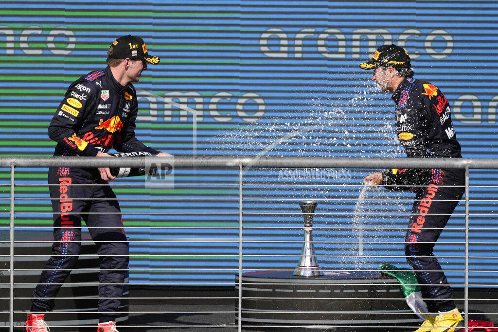 Nick Didlick Red Bull drivers Max Verstappen, left, of the Netherlands, and Sergio Perez, of Mexico, celebrate following the Formula One U.S. Grand Prix auto race at Circuit of the Americas, Sunday, Oct. 24, 2021, in Austin, Texas. Verstappen won the race and Perez finished third. (AP Photo/Nick Didlick)