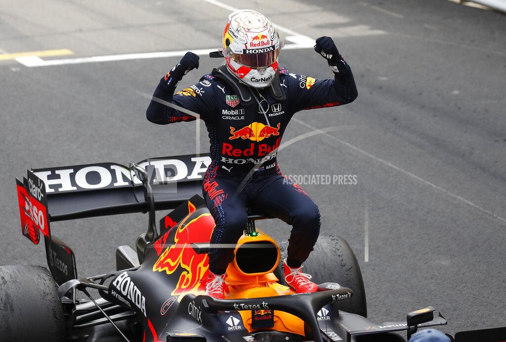 Gonzalo Fuentes Red Bull driver Max Verstappen of the Netherlands celebrates on his car after winning the Monaco Grand Prix at the Monaco racetrack, in Monaco, Sunday, May 23, 2021. (Gonzalo Fuentes, Pool via AP)
