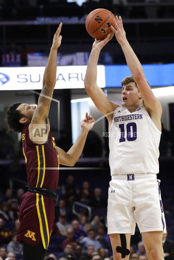 Nam Y. Huh Northwestern forward Miller Kopp, right, shoots against Minnesota guard Payton Willis during the second half of an NCAA college basketball game in Evanston, Ill., Sunday, Feb. 23, 2020. (AP Photo/Nam Y. Huh)