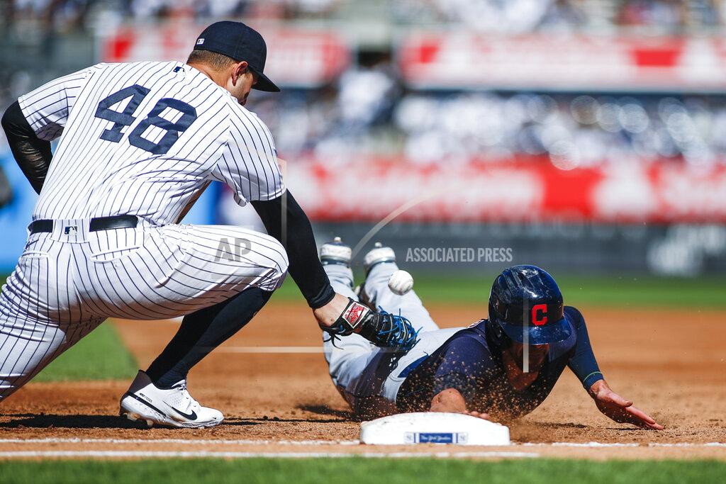 Eduardo Munoz Alvarez Cleveland Indians' Bradley Zimmer, right, dives safely into first base as New York Yankees' Anthony Rizzo tries to tag him out in the second inning of a baseball game, Sunday, Sept. 19, 2021, in New York. (AP Photo/Eduardo Munoz Alvarez)