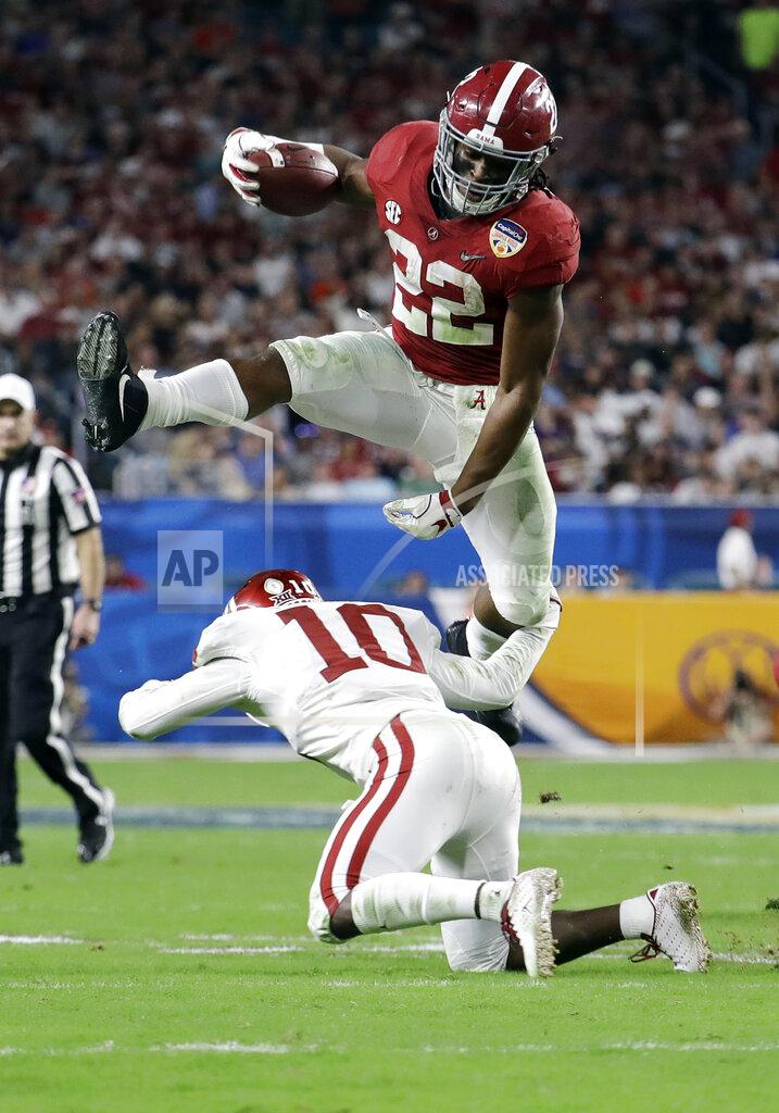 Lynne Sladky Alabama running back Najee Harris (22) jumps over Oklahoma safety Patrick Fields (10), during the first half of the Orange Bowl NCAA college football game, Saturday, Dec. 29, 2018, in Miami Gardens, Fla. (AP Photo/Lynne Sladky)