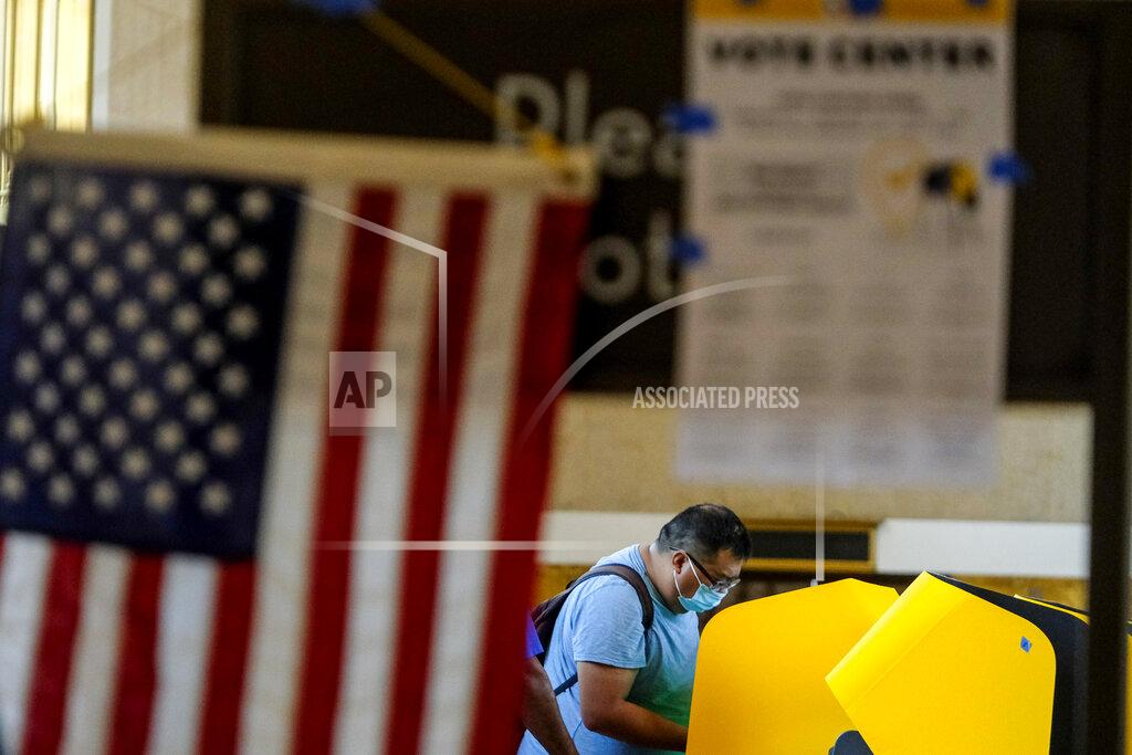 Ringo H.W. Chiu A voter casts a ballot for the California recall election at a vote center at Union Station, Tuesday, Sept. 14, 2021, in Los Angeles. (AP Photo/Ringo H.W. Chiu)