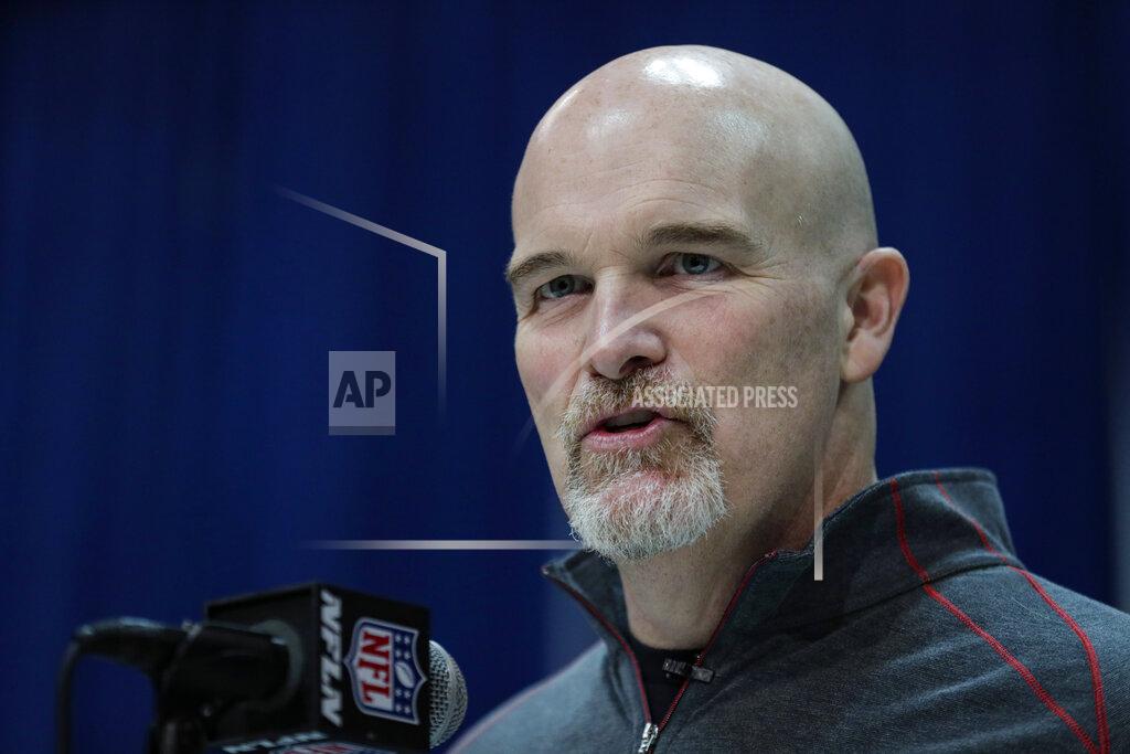 FILE - In this Feb. 25, 2020, file photo, Atlanta Falcons head coach Dan Quinn speaks during a press conference at the NFL football scouting combine in Indianapolis. The Falcons have the No. 16 overall pick in the NFL draft following their second consecutive 7-9 finish. Coach Dan Quinn saved his job with four straight wins to finish 2019. The pressure is on Quinn and GM Thomas Dimitroff to win in 2020. (AP Photo/Michael Conroy, File)