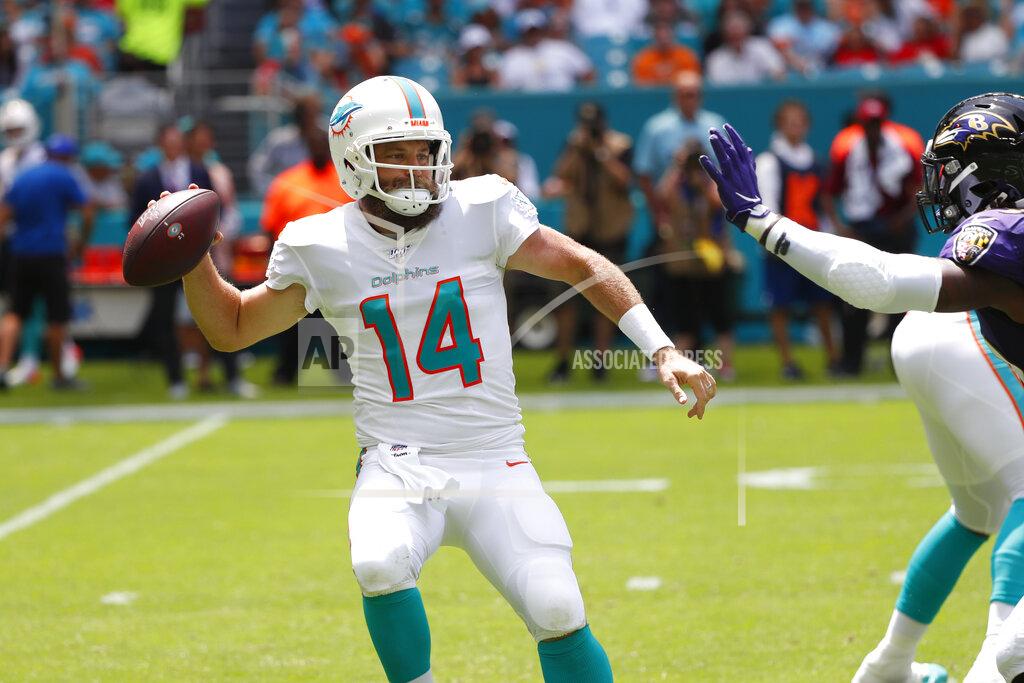 Wilfredo Lee Miami Dolphins quarterback Ryan Fitzpatrick (14) looks to pass, during the first half at an NFL football game against the Baltimore Ravens, Sunday, Sept. 8, 2019, in Miami Gardens, Fla. (AP Photo/Wilfredo Lee)