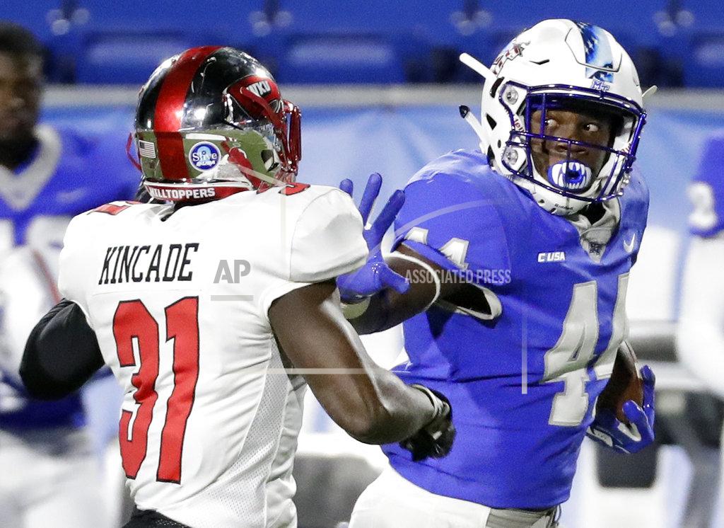 Mark Humphrey Middle Tennessee running back Chaton Mobley (44) tries to keep Western Kentucky defensive back Antwon Kincade (31) away in the first half of an NCAA college football game Friday, Nov. 2, 2018, in Murfreesboro, Tenn. (AP Photo/Mark Humphrey)
