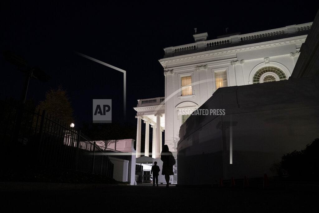 Evan Vucci People walk toward the White House, Tuesday, Nov. 10, 2020, in Washington. (AP Photo/Evan Vucci)