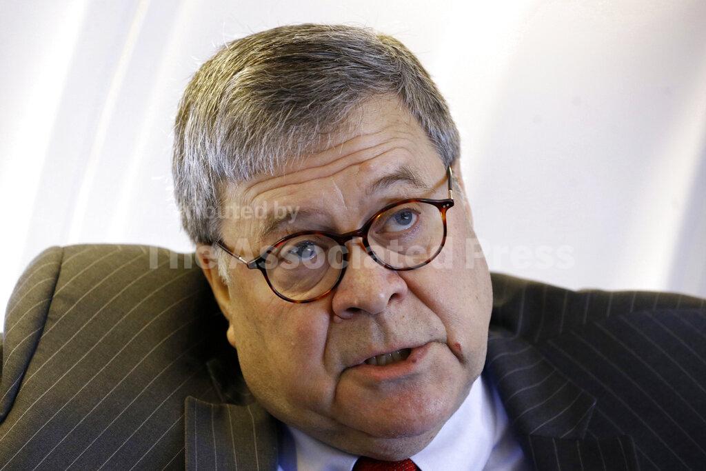 Attorney General William Barr speaks with an Associated Press reporter onboard an aircraft en route to Cleveland, Thursday, Nov. 21, 2019, during a two-day trip to Ohio and Montana. (AP Photo/Patrick Semansky)