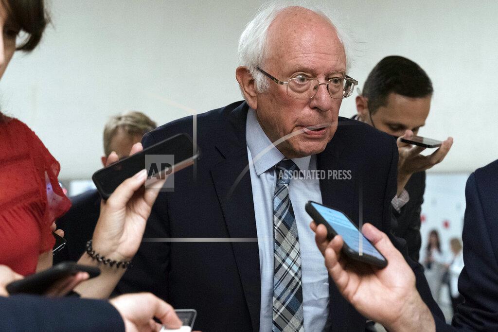 Jose Luis Magana Sen. Bernie Sanders, I-Vt., talks to reporters as he walks to the senate chamber ahead of a test vote scheduled by Democratic Leader Chuck Schumer of New York on the bipartisan infrastructure deal senators brokered with President Joe Biden, on Capitol Hill, in Washington, Wednesday, July 21, 2021. Republicans prepared to block the vote by mounting a filibuster over what they see as a rushed and misguided process. (AP Photo/Jose Luis Magana)