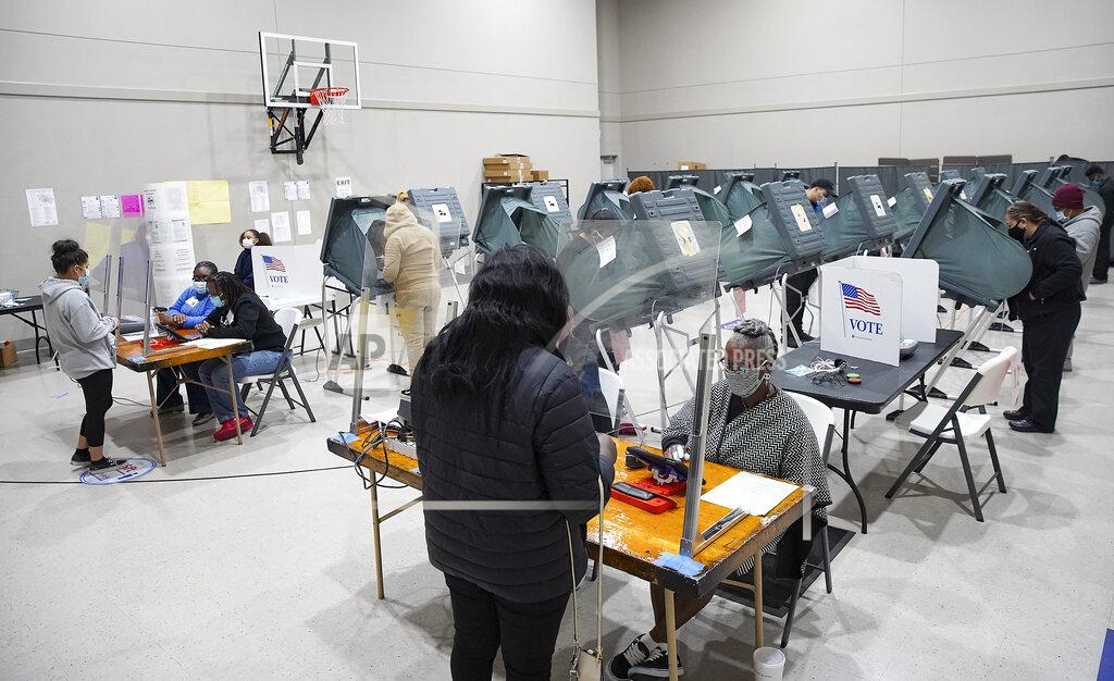 Elizabeth Conley Voters cast their ballots for the general election at Victory Houston polling station in Houston, on Friday, Oct. 30, 2020. The location was one of the Harris County's 24-hour locations. (Elizabeth Conley/Houston Chronicle via AP)