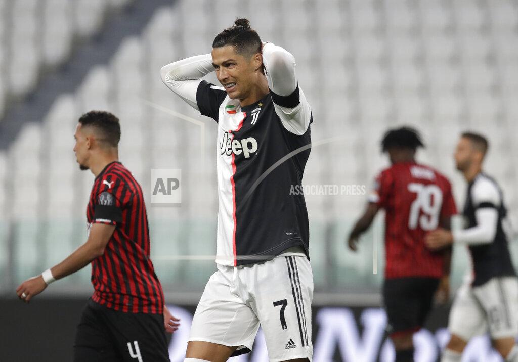 Luca Bruno Juventus' Cristiano Ronaldo grimaces during an Italian Cup second leg soccer match between Juventus and AC Milan at the Allianz stadium, in Turin, Italy, Friday, June 12, 2020. The match was being played without spectators because of the coronavirus lockdown. (AP Photo/Luca Bruno)