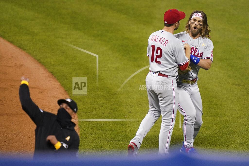 John Minchillo Philadelphia Phillies right fielder Bryce Harper, right, reacts as umpire Roberto Ortiz, left, ejects Harper during the fifth inning of the team's baseball game against the New York Mets, Saturday, Sept. 5, 2020, in New York. (AP Photo/John Minchillo)