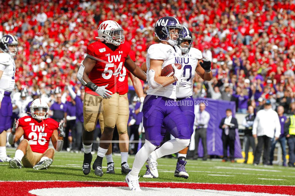 Andy Manis Northwestern running back Drake Anderson (6) scores a touchdown against Wisconsin safety Eric Burrell (25) and linebacker Chris Orr (54) during the second half of an NCAA college football game Saturday, Sept. 28, 2019, in Madison, Wis. Wisconsin won 24-15. (AP Photo/Andy Manis)