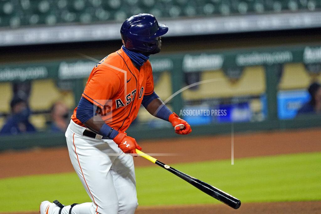 David J. Phillip Houston Astros' Yordan Alvarez watches his three-run home run against the Seattle Mariners during the first inning of a baseball game Friday, Aug. 14, 2020, in Houston. (AP Photo/David J. Phillip)