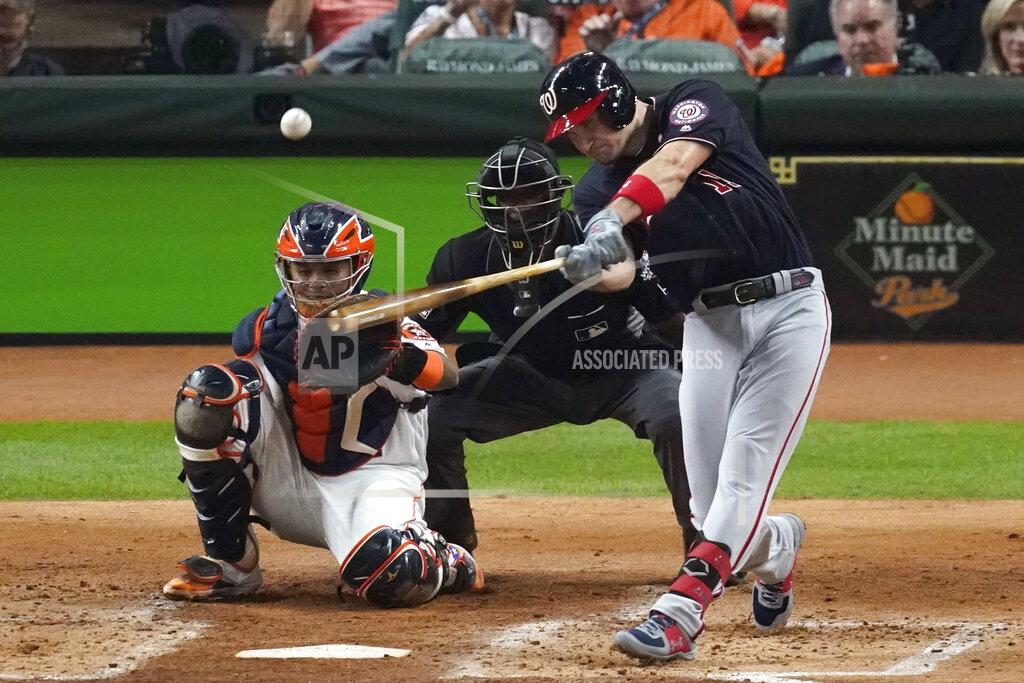 FILE - In this Oct. 22, 2019, file photo, Washington Nationals' Ryan Zimmerman hits a home run during the second inning of Game 1 of the baseball World Series against the Houston Astros, in Houston. With baseball on hold because of the coronavirus pandemic, Zimmerman occasionally will offer his thoughts via diary entries published by the AP, while waiting for the 2020 season to begin. (AP Photo/Eric Gay, File)