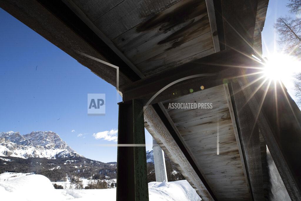 A view of the bobsled track in Cortina d'Ampezzo, Italy, Wednesday, Feb. 17, 2021. Bobsledding tradition in Cortina goes back nearly a century and locals are hoping that the Eugenio Monti track can be reopened for the 2026 Olympics in the Italian resort. (AP Photo/Gabriele Facciotti)