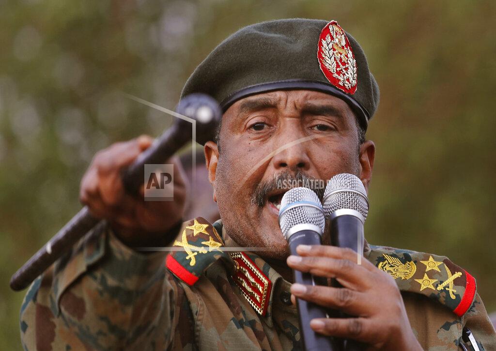 FILE - In this June 29, 2019 file photo, Sudanese Gen. Abdel-Fattah Burhan, head of the military council, speaks during a military-backed rally, in Omdurman district, west of Khartoum, Sudan. Officials in Sudan confirmed that a senior U.S.-Israeli delegation flew to Sudan on a private jet Wednesday, Oct. 21, 2020, and met with Burhan and others to wrap up a deal that would make Sudan the third Arab country to normalize ties with Israel this year. (AP Photo/Hussein Malla, File)