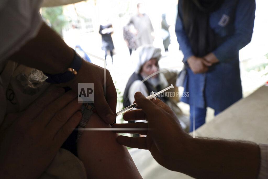 Rahmat Gul FILE - In this Sunday, July 11, 2021 file photo, a woman receives the Johnson & Johnson COVID-19 vaccine at a vaccination center with COVID-19 vaccines donated by the United States and delivered through the U.N.-backed COVAX program, in Kabul, Afghanistan. In late June, the international system for sharing coronavirus vaccines sent about 530,000 doses to Britain – more than double the amount sent that month to the entire continent of Africa. It was the latest example of how a system that was supposed to guarantee low and middle-income countries vaccines is failing, leaving them at the mercy of haphazard donations from rich countries. (AP Photo/Rahmat Gul, file)