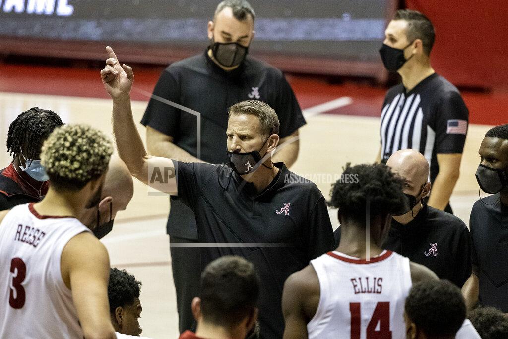 Vasha Hunt Alabama head coach Nate Oats, center, works with his team during the second half of an NCAA college basketball game against Mississippi State, Saturday, Jan. 23, 2021, in Tuscaloosa, Ala. (AP Photo/Vasha Hunt)