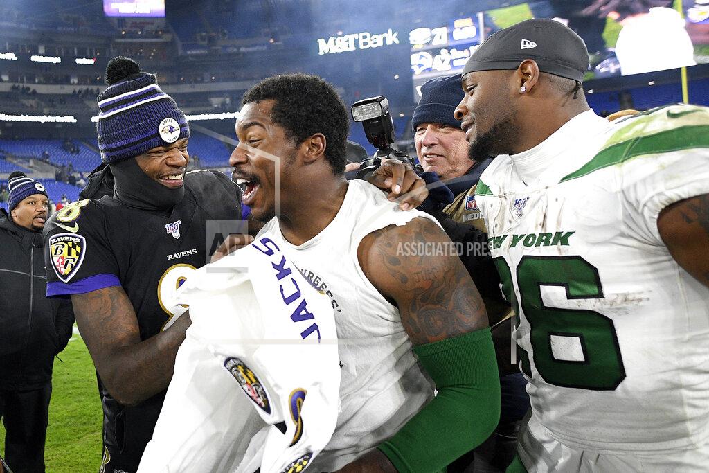 Nick Wass Baltimore Ravens quarterback Lamar Jackson, left, laughs with New York Jets outside linebacker James Burgess, center, as running back Le'Veon Bell, right, looks on after an NFL football game, Thursday, Dec. 12, 2019, in Baltimore. The Ravens won 42-21. (AP Photo/Nick Wass)