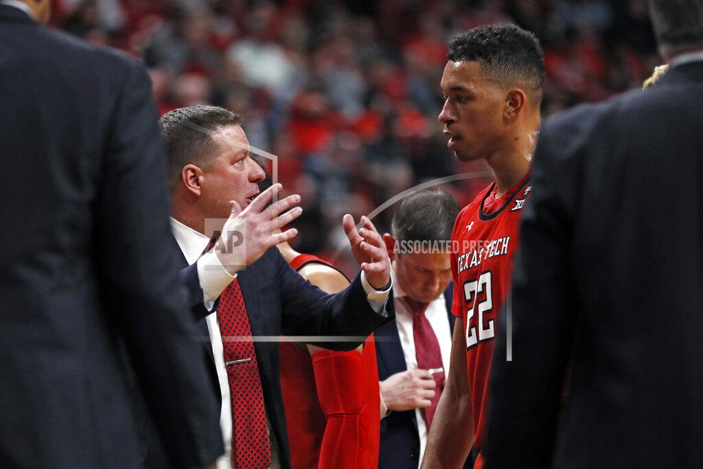 Brad Tollefson Texas Tech coach Chris Beard talks to TJ Holyfield (22) on the sidelines during the second half of an NCAA college basketball game against Texas, Saturday, Feb. 29, 2020, in Lubbock, Texas. (AP Photo/Brad Tollefson)