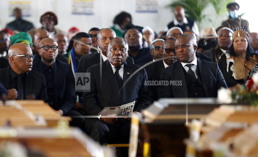 Uncredited South African President Cyril Ramaphosa attends a funeral service held in Scenery Park, East London, South Africa, Wednesday, July 6, 2022. More than a thousand grieving family and community members are attending the funeral in South Africa's East London for 21 teenagers who died in a mysterious tragedy at a nightclub nearly two weeks ago. Ramaphosa is due to give the eulogy for the young who died. (AP Photo)