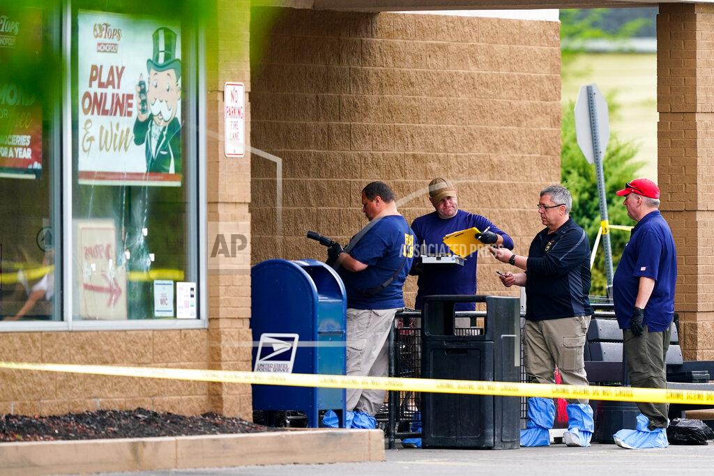 Matt Rourke Investigators work the scene of a shooting at a supermarket, in Buffalo, N.Y., Monday, May 16, 2022. (AP Photo/Matt Rourke)