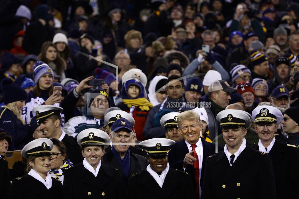Matt Rourke President Donald Trump stands in the seating along the Navy sidelines before the second half of a NCAA college football game between Army and Navy, Saturday, Dec. 8, 2018, in Philadelphia. (AP Photo/Matt Rourke)