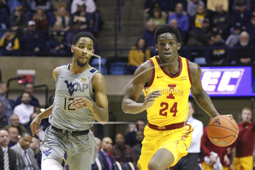 Kathleen Batten Iowa State guard Terrence Lewis (24) drives up court as he is defended by West Virginia guard Taz Sherman (12) during the first half of an NCAA college basketball game Wednesday, Feb. 5, 2020, in Morgantown, W.Va. (AP Photo/Kathleen Batten)