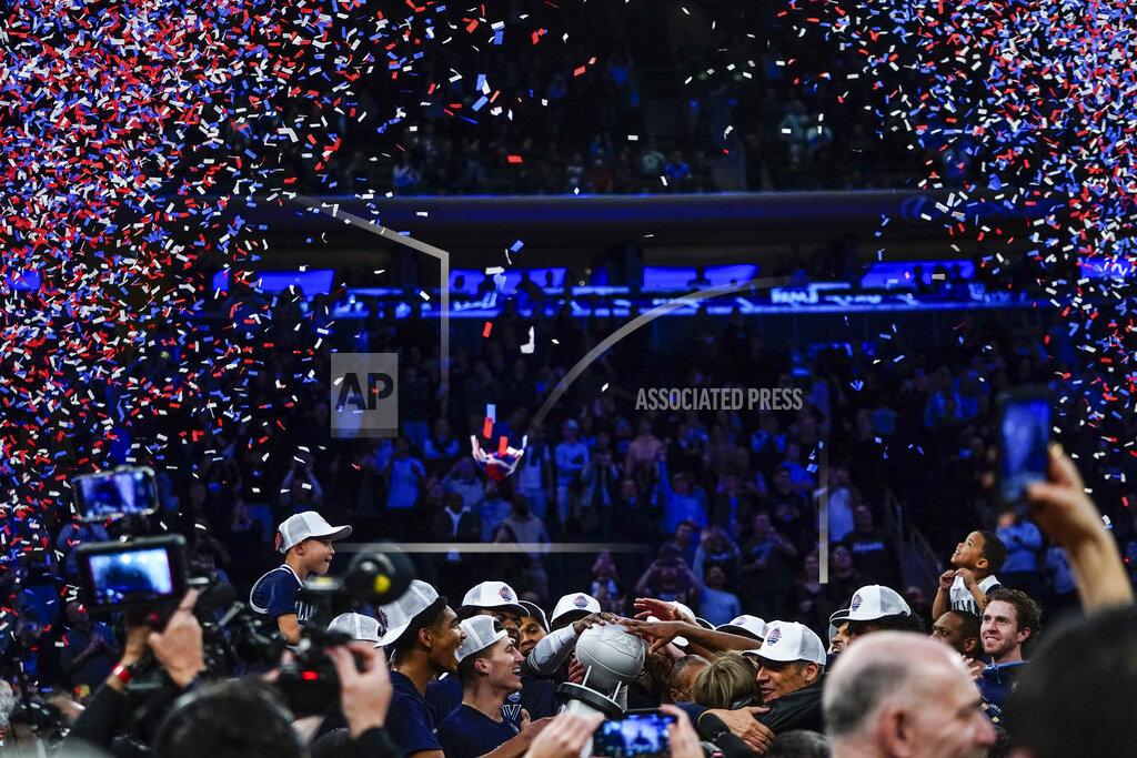 Frank Franklin Ii Villanova's Collin Gillespie, center, celebrates with teammates around the tournament trophy after an NCAA college basketball game against Creighton in the final of the Big East conference tournament Saturday, March 12, 2022, in New York. (AP Photo/Frank Franklin II)