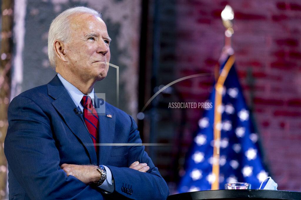 Andrew Harnik FILE - In this Wednesday, Oct. 28, 2020 file photo, Democratic presidential candidate former Vice President Joe Biden waits to surprise Mildred Madison, 94, on a Zoom with Oprah Winfrey virtual show at The Queen theater in Wilmington, Del. Madison traveled 300 Miles from the Chicago area to Detroit to make sure her vote counted for Joe Biden. Delaware residents have their first opportunity in the four-decade political career of home-state favorite Joe Biden to vote for him as a presidential candidate in a general election. Tuesday's balloting also includes Republican challenges to two of the three members of Delaware's all-Democrat congressional delegation and to incumbent Democratic Gov. John Carney. (AP Photo/Andrew Harnik, File)