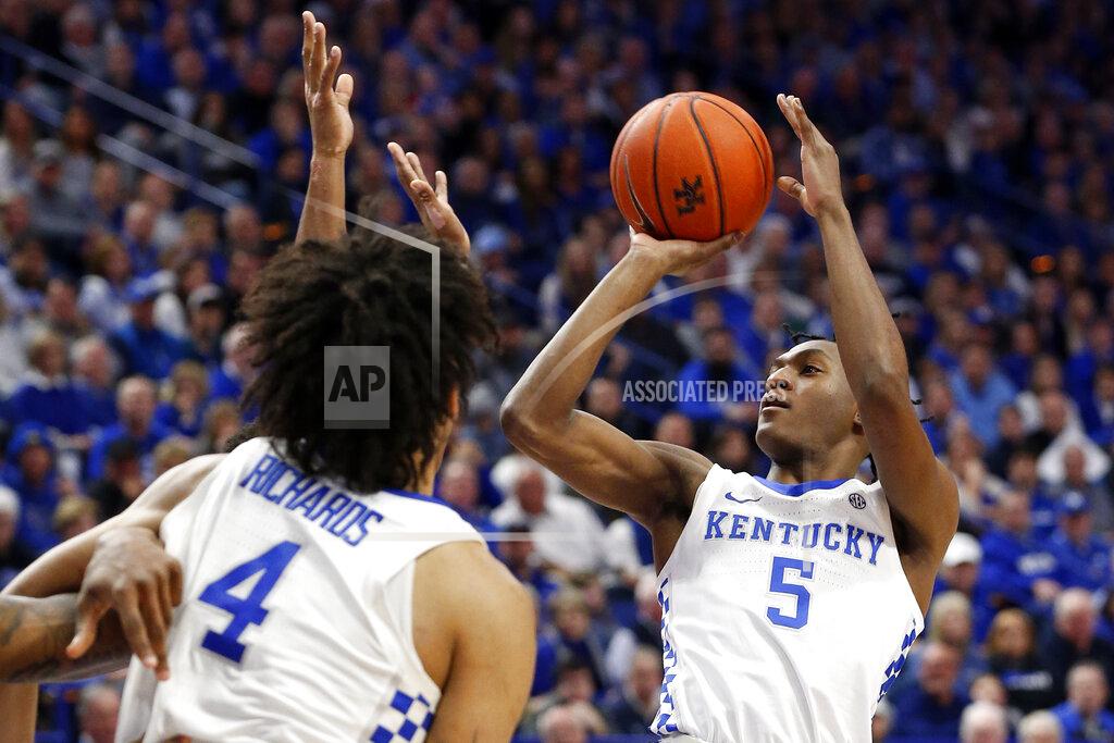 James Crisp Kentucky's Immanuel Quickley (5) shoots near teammate Nick Richards (4) in the second half of an NCAA college basketball game against Mississippi in Lexington, Ky., Saturday, Feb. 15, 2020. Kentucky won 67-62. (AP Photo/James Crisp)