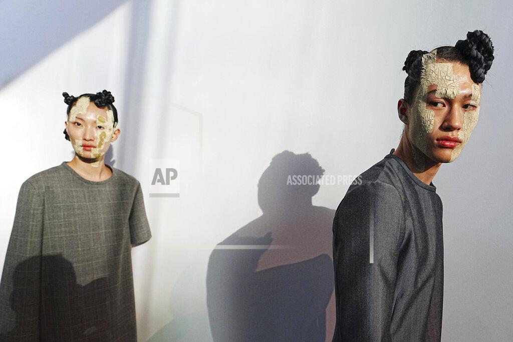 Charles Sykes Models appear backstage in preparation for the Thom Browne fashion show during New York Fashion Week at The Shed, on Saturday, Sept. 11, 2021, in New York. (Photo by Charles Sykes/Invision/AP)