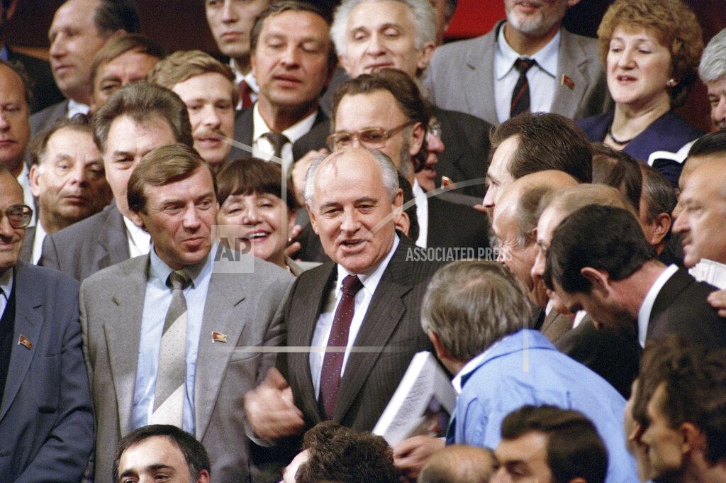 Alexander Zemlianichenko FILE - In this Thursday, Sept. 5, 1991 file photo, Soviet President Mikhail Gorbachev is surrounded by members of the Congress of People's Deputies at the Kremlin, Moscow after the lawmaking body, meeting for perhaps the last time ever, accepted Gorbachev's proposal to transform Soviet government. Former Soviet leader Mikhail Gorbachev turned 90 on Tuesday March 2, 2021, receiving greetings from the Kremlin and global leaders while Russians remained divided over his legacy. (AP Photo/Alexander Zemlianichenko, File)