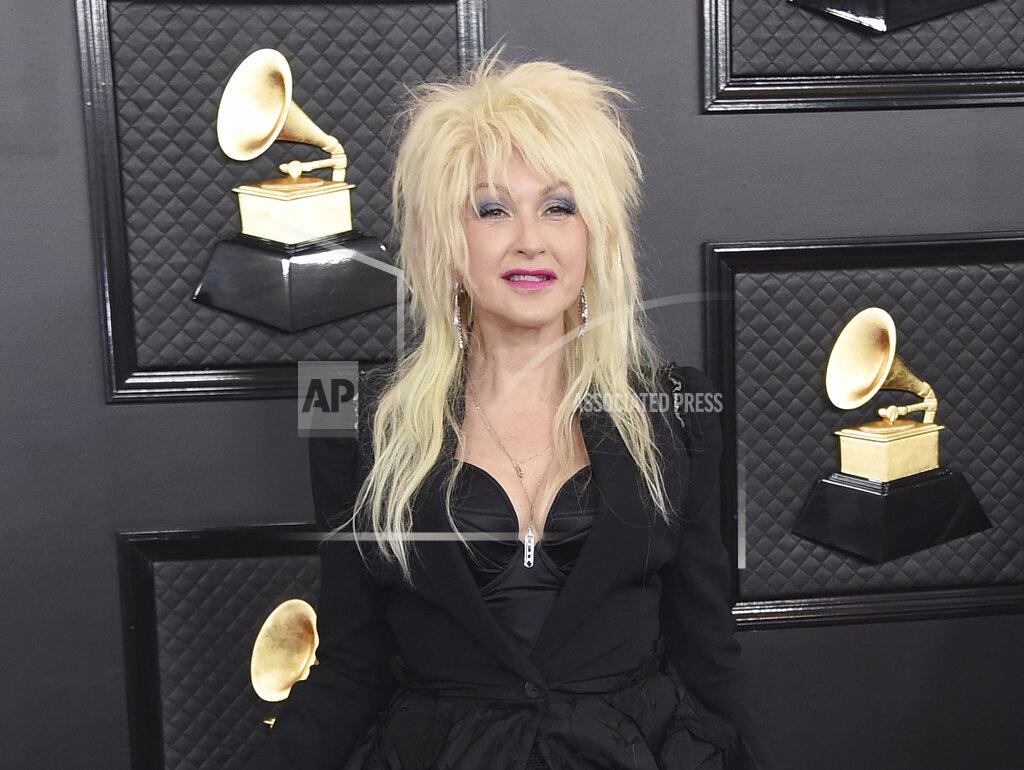 Jordan Strauss FILE - Cyndi Lauper arrives at the 62nd annual Grammy Awards in Los Angeles on Jan. 26, 2020. Lauper’s annual concert to combat youth homelessness, an issue its organizer says has only gotten worse during the pandemic, will premiere on Friday on Lauper's TikTok channel at 8 p.m. EST, with an additional stream Sunday at 8 p.m. EST on Lauper’s YouTube and Facebook handles. This year’s concert will free to watch, with donation encouraged. (Photo by Jordan Strauss/Invision/AP, File)