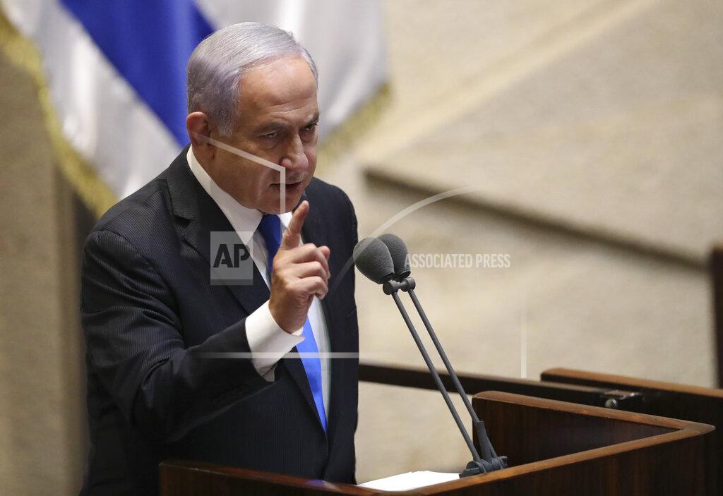 Ariel Schalit Israel's outgoing prime minister Benjamin Netanyahu speaks during a Knesset session in Jerusalem Sunday, June 13, 2021. Bennett is expected later Sunday to be sworn in as the country's new prime minister, ending Prime Minister Benjamin Netanyahu's 12-year rule. (AP Photo/Ariel Schali22