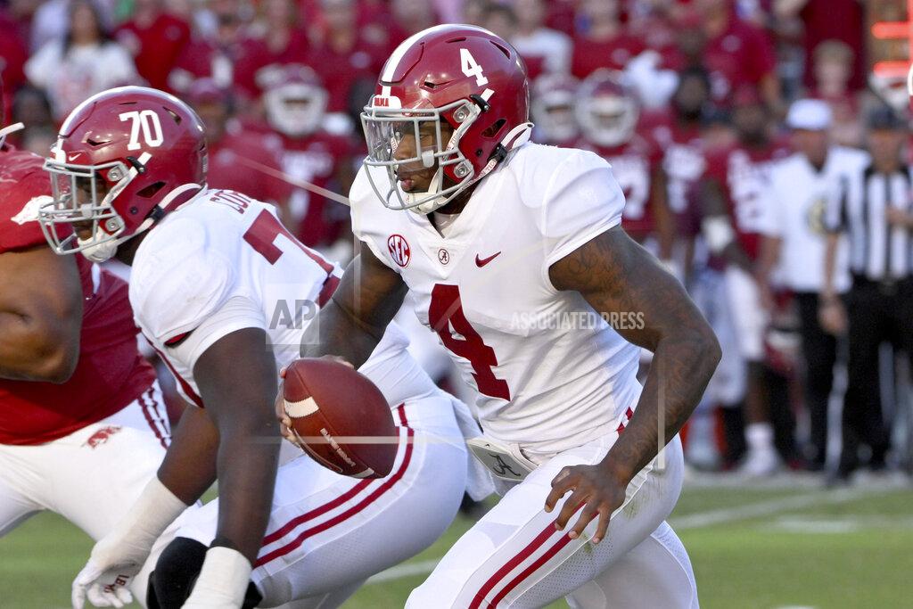 Michael Woods Alabama quarterback Jalen Milroe (4) runs the ball against Arkansas during the second half of an NCAA college football game Saturday, Oct. 1, 2022, in Fayetteville, Ark. (AP Photo/Michael Woods)