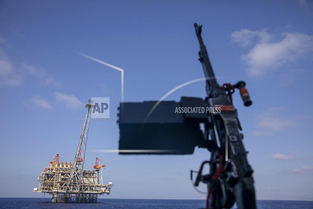 File - In this Tuesday, Sept. 29, 2020 file photo, Israel's offshore Leviathan gas field is seen from on board the Israeli Navy Ship Lahav during a rare tour in the Mediterranean Sea, Israel. Five years after Israel signed a landmark agreement to develop large offshore gas fields over the objections of antitrust authorities, environmentalists and consumer advocates, ordinary Israelis have yet to see the windfall promised by the government. (AP Photo/Ariel Schalit, File)
