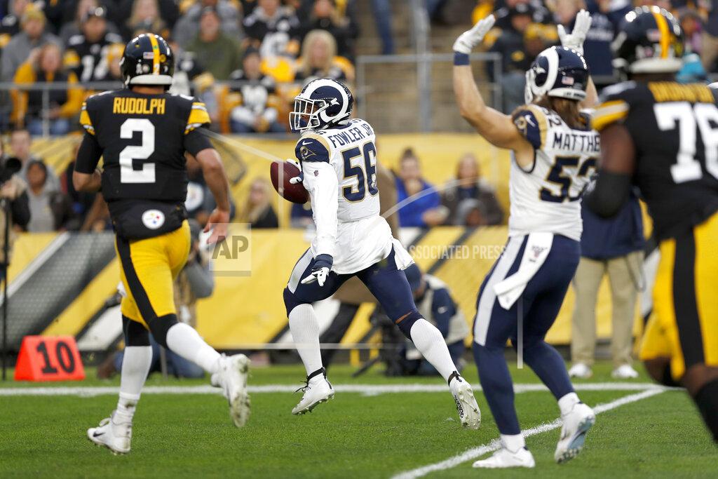 Keith Srakocic Los Angeles Rams defensive end Dante Fowler (56) heads for the end zone for a touchdown after recovering a fumble during the first half of an NFL football game against the Pittsburgh Steelers in Pittsburgh, Sunday, Nov. 10, 2019. (AP Photo/Keith Srakocic)